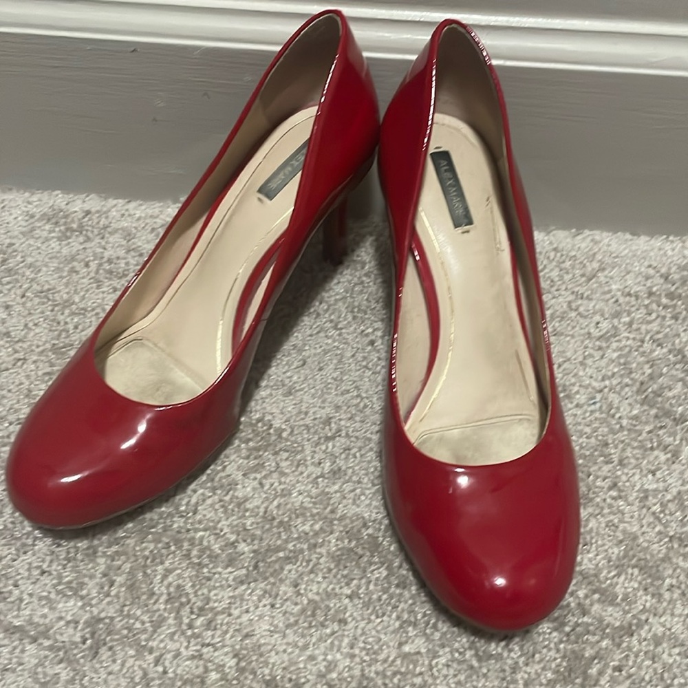 Red patent faux leather low heeled dress shoes.